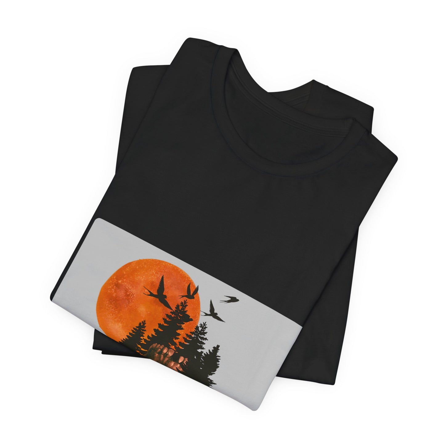 Black t-shirt with a sunset and tree design on a white background