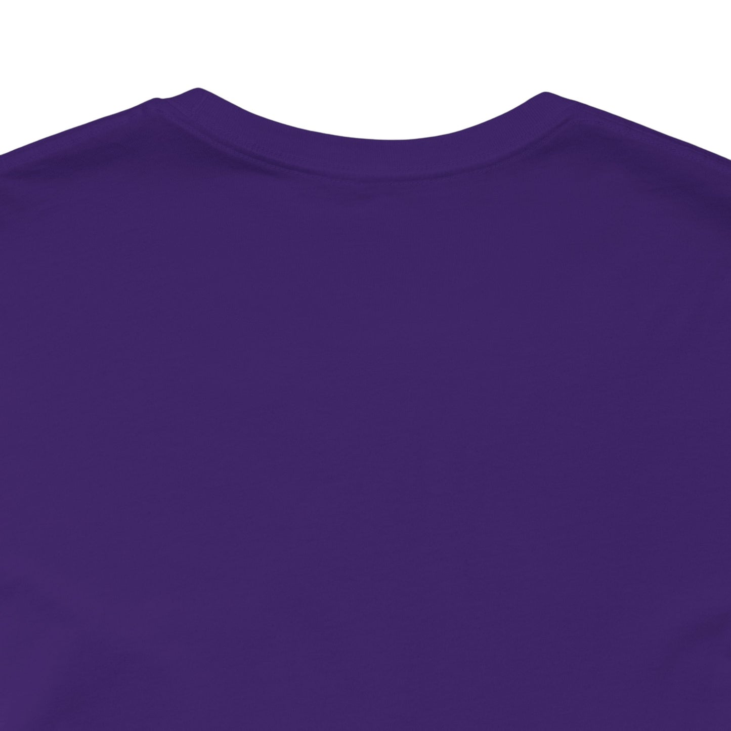 Close-up of a purple shirt with a plain background
