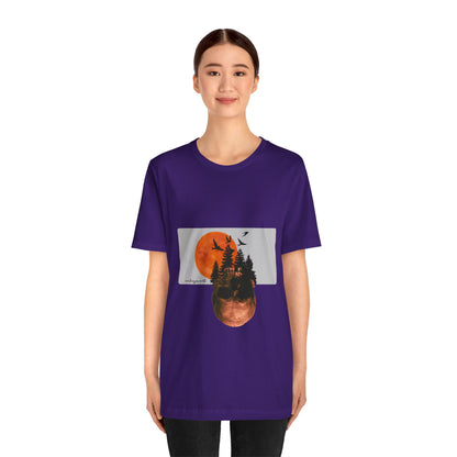 Person wearing a purple t-shirt with a graphic design on a white background